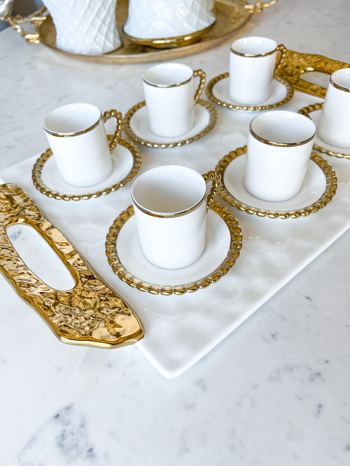 http://htsdecor.com/cdn/shop/products/gold-beaded-espresso-cups-with-saucer-set-of-6-593571.jpg?v=1683503524&width=1200