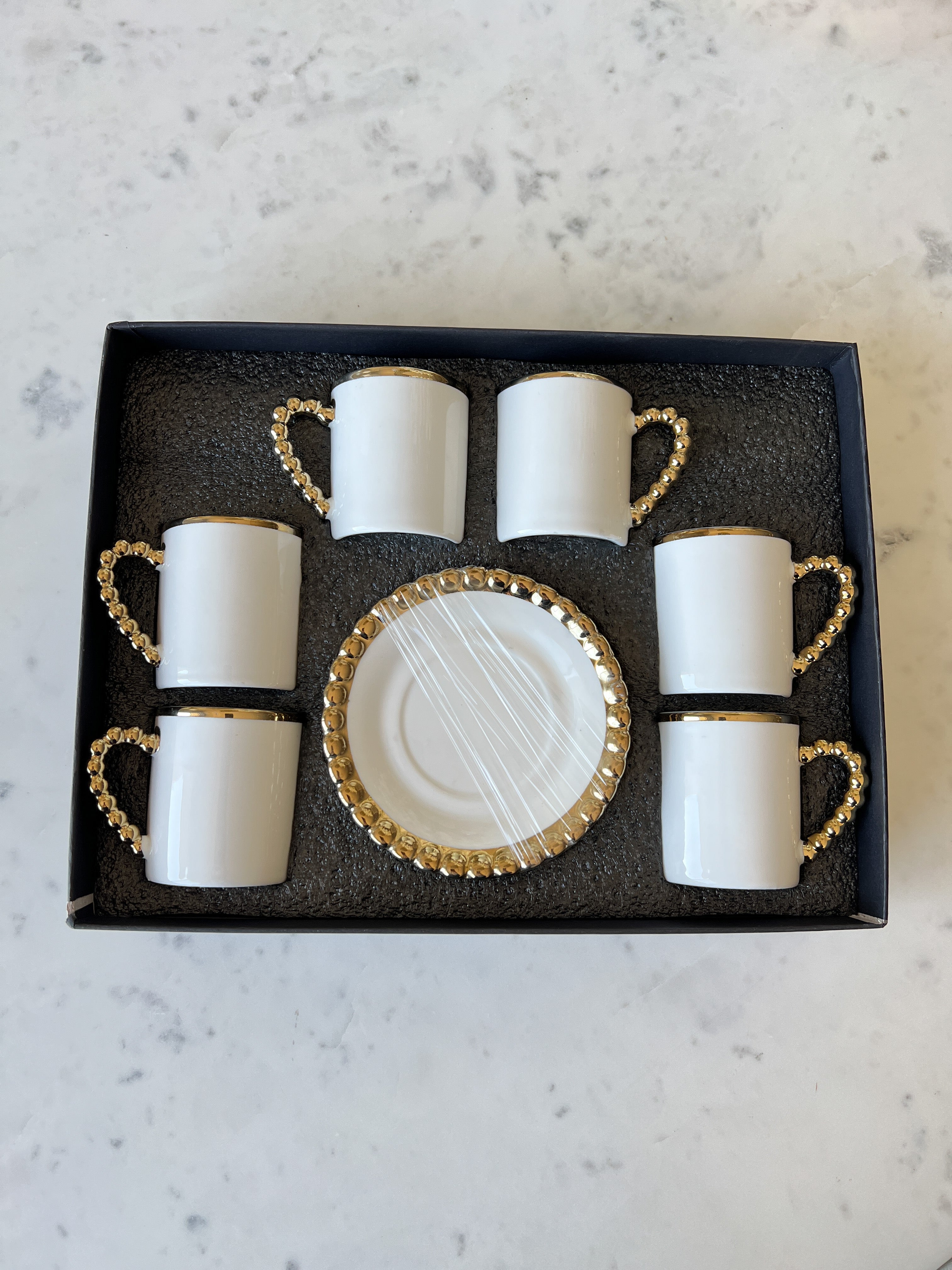 https://htsdecor.com/cdn/shop/products/gold-beaded-espresso-cups-with-saucer-set-of-6-469729.jpg?v=1683503524